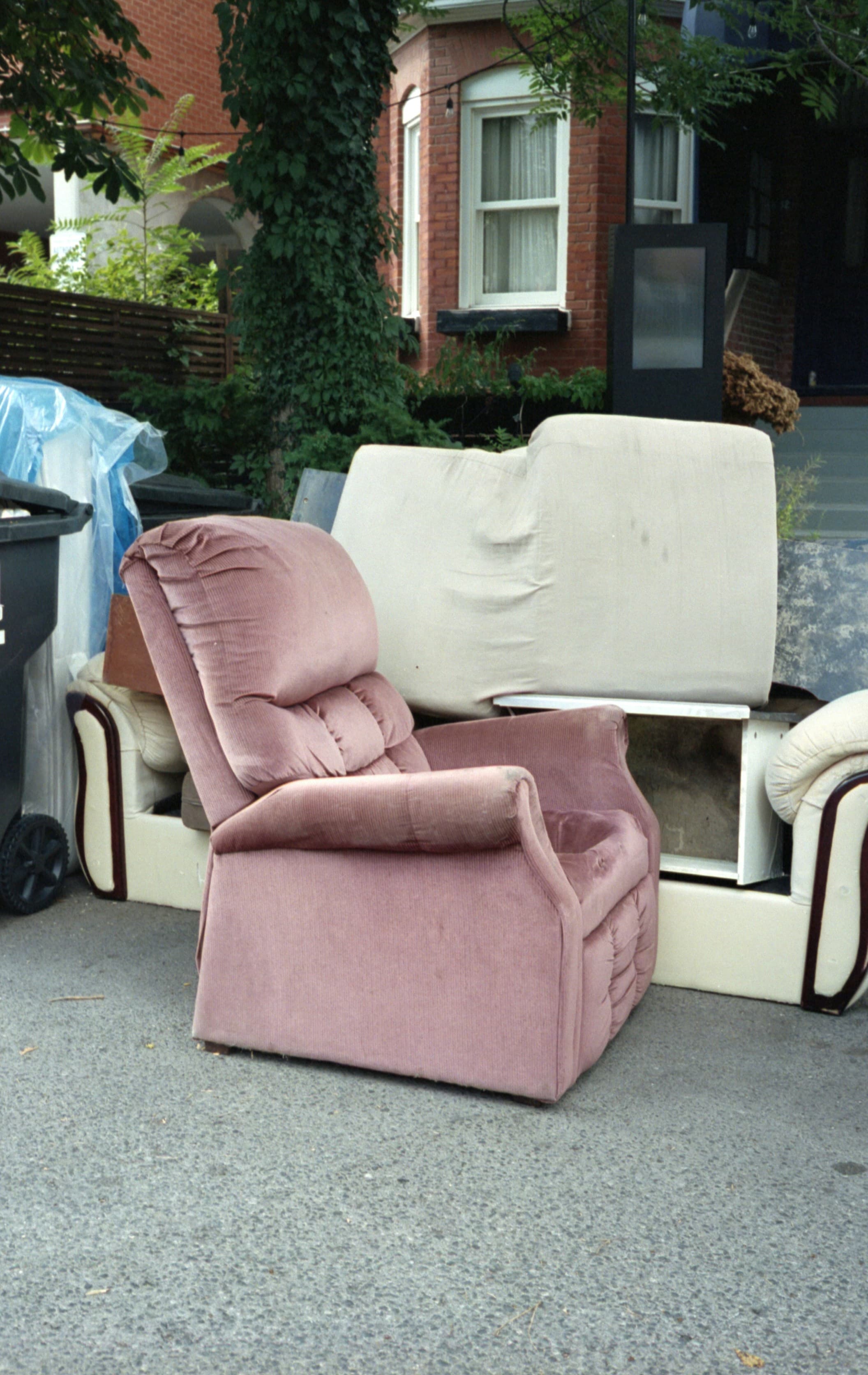 Rubbish removal pickup in residential driveway